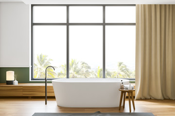 White and green bathroom, tub and window