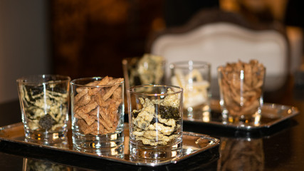 Dry food in many glasses for snacks.