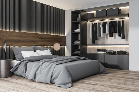 Wooden and white bedroom corner with wardrobe