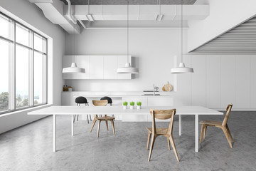 White kitchen interior with table
