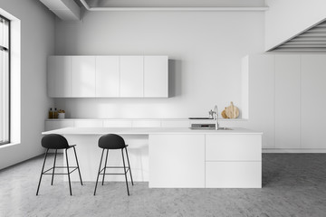 White kitchen interior with bar