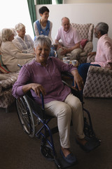 Disabled senior woman smiling in living room