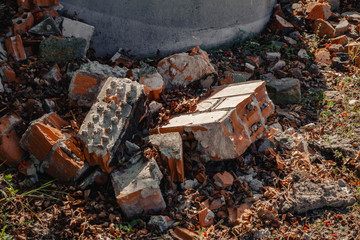 a ruined old wall of red bricks. destruction
