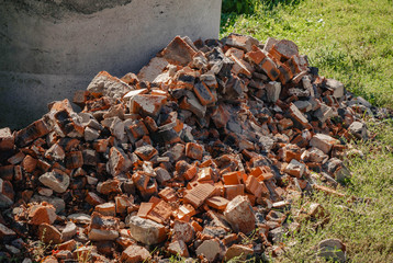 a ruined old wall of red bricks. destruction
