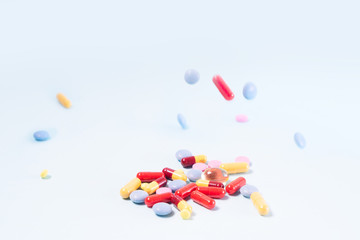 Pile of pills on blue