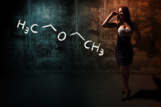 Sexy girl or secretary or female student presenting handdrawn chemical formula of Diethylether