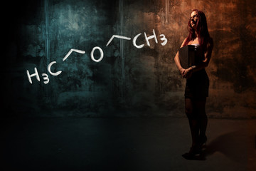 Sexy girl or secretary or female student presenting handdrawn chemical formula of Diethylether