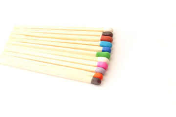 Row of colorful matches isolated on white background