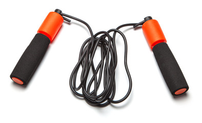 Jump rope. Fun exercises for body health. Orange rope with black cord. Isolated on white background
