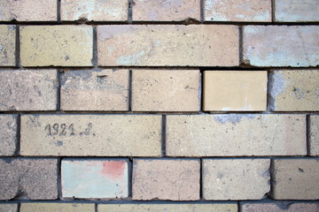 Light old building brick wall pattern design background with written date