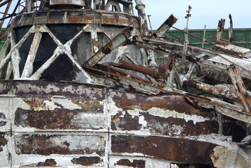 rusty decaying metal structure with magnesium calcium deposit