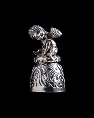 bell with an angel on a black background isolate