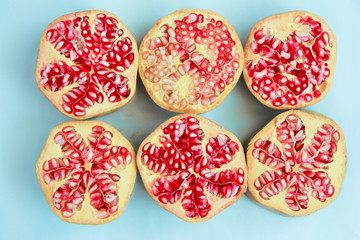 round slices of natural pink pomegranate with grains