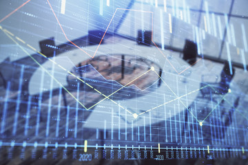 Double exposure of forex chart on conference room background. Concept of stock market analysis