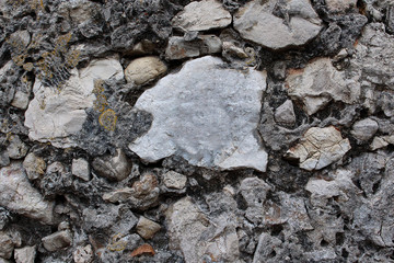 Dark gray textured old sand stone wall background