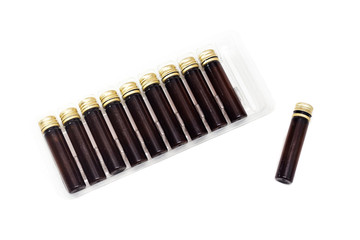 small cosmetics plastic bottles with golden cup isolated on white background