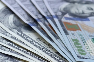 Many hundred dollar bills