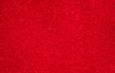 Viburnum berries juice with sugar as red background.