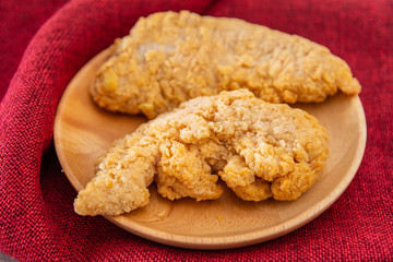 Chicken Wings Spicy chicken wings, breaded, fried, cooked.