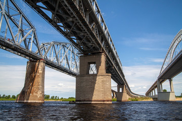 Fototapeta premium Railroad and road bridges over the Vilga river