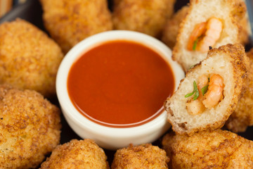 Tapioca fried balls stuffed with shrimp and pepper sauce