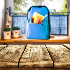 Fototapeta na wymiar Table background of free space and school backpack. 