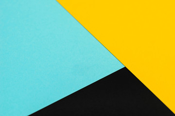 Yellow, blue, black, colored paper background
