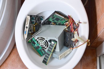 Old and unused computer details is recycled in toilet bowl