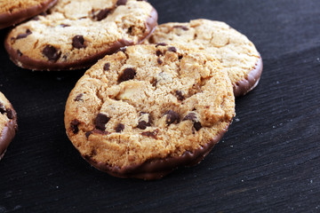 Chocolate cookies on wooden table. Chocolate chip cookies shot on table
