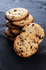 Chocolate cookies on wooden table. Chocolate chip cookies shot on table