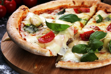 vegetarian italian Pizza with tomatoes, mozzarella cheese  and basil. Delicious italian pizza