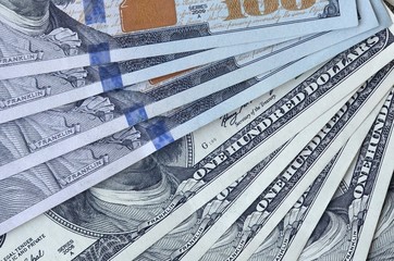 Many hundred dollar bills