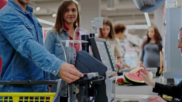People buying goods in a grocery store