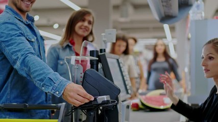 People buying goods in a grocery store