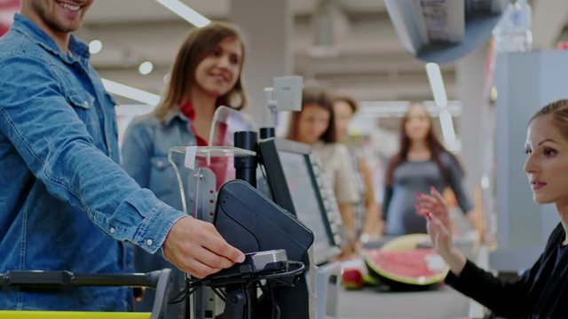 People buying goods in a grocery store