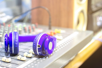 Headphones on the audio mixer in the control room.
