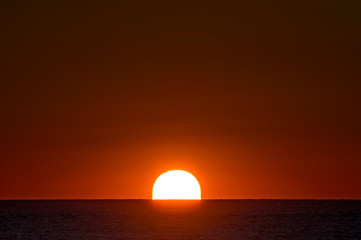 Rising Sun Over Ocean