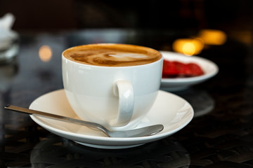 cup of coffee on a table with soft background