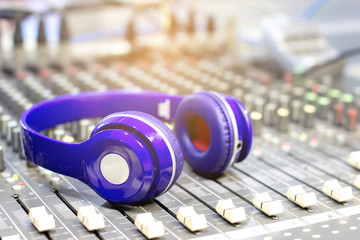 Plakat Headphones on the audio mixer in the control room.
