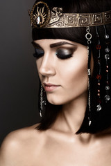 Close-up portrait of beautiful woman with bright make-up. Cleopatra
