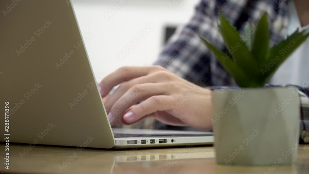 Poster working on laptop computer. freelancer's hands typing on laptop keyboard text. business concept.hand