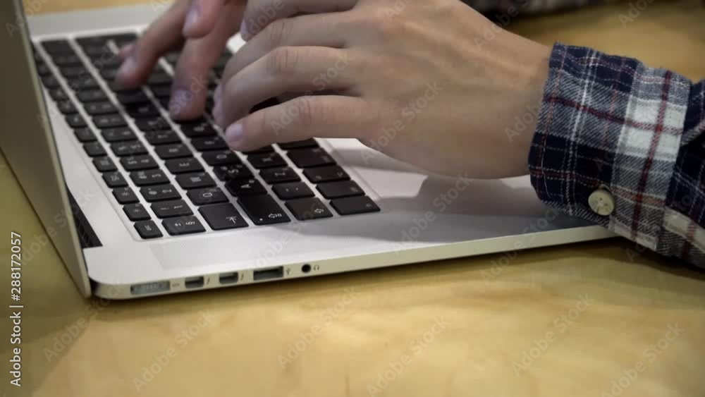 Poster working on laptop computer. freelancer's hands typing on laptop keyboard text. business concept.hand