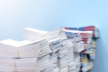 Stacks of paper files work desk office, business report papers, piles of unfinished documents, Business concept.