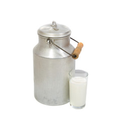 Glass of fresh milk and retro milk canister on white background