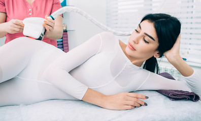 woman getting a cellulite removal massage, at beauty clinic