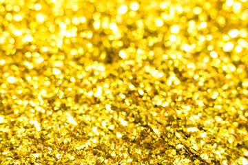 Gold glitter texture. Festive sparkling sequins background. Wpaper for Valentine, New Year or Christmas Holidays.