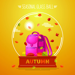 Autumn school bag in a glass ball on a orange background