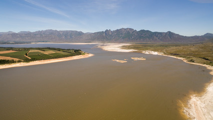 Fototapeta na wymiar Cape Town, South Africa, January 21, 2019: The main water supply dam to the Cape Peninsula, at very low water levels. 