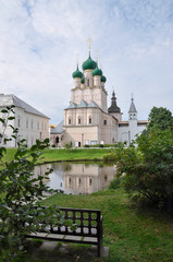 View of the pond and the bench in front of the Church of St. John the Theologian, which was built in 1680 and the Red chamber. Golden ring of Russia, Rostov Veliky, Russia