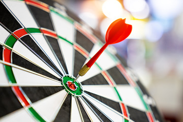 Darts board with arrows hitting the center target, focuses on success, planning to be smart concept.
